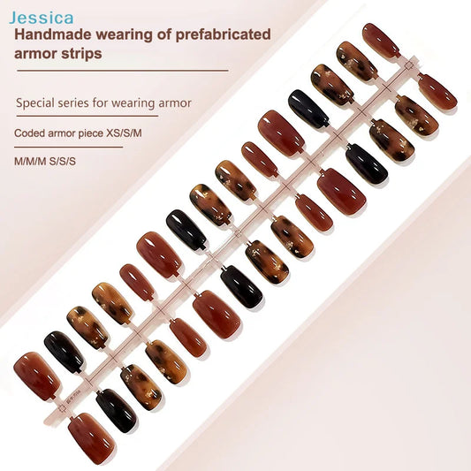 Set of brown and black nail armor strips on a display board with product details.