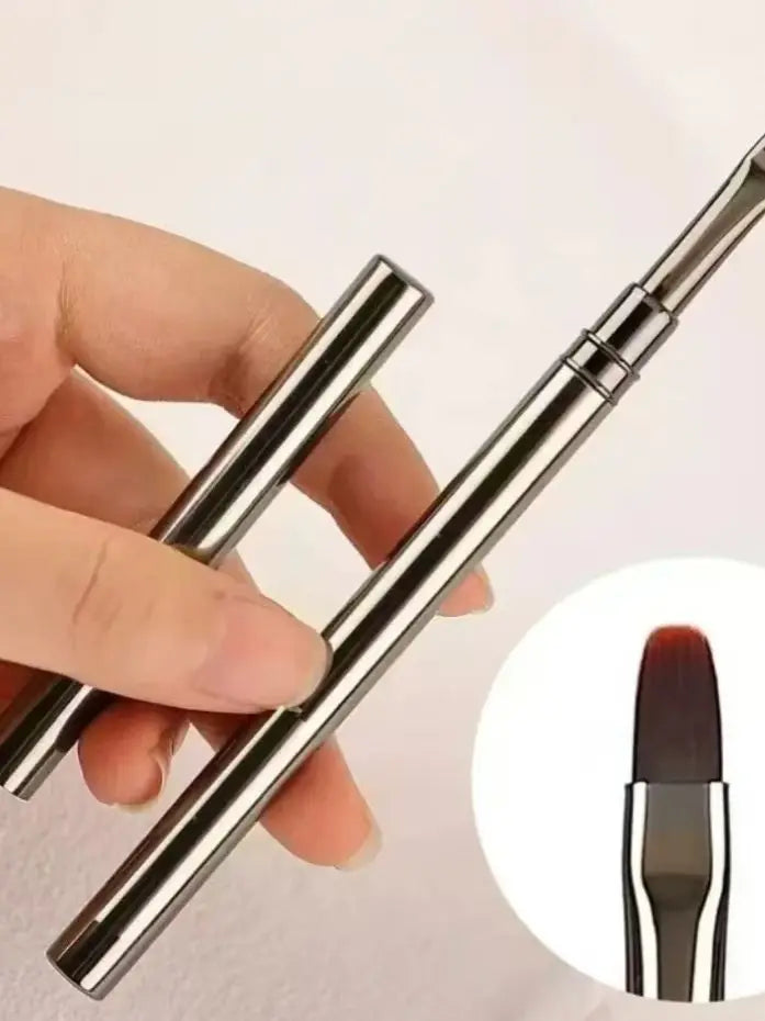 Metallic makeup brush with a close-up inset on a white background