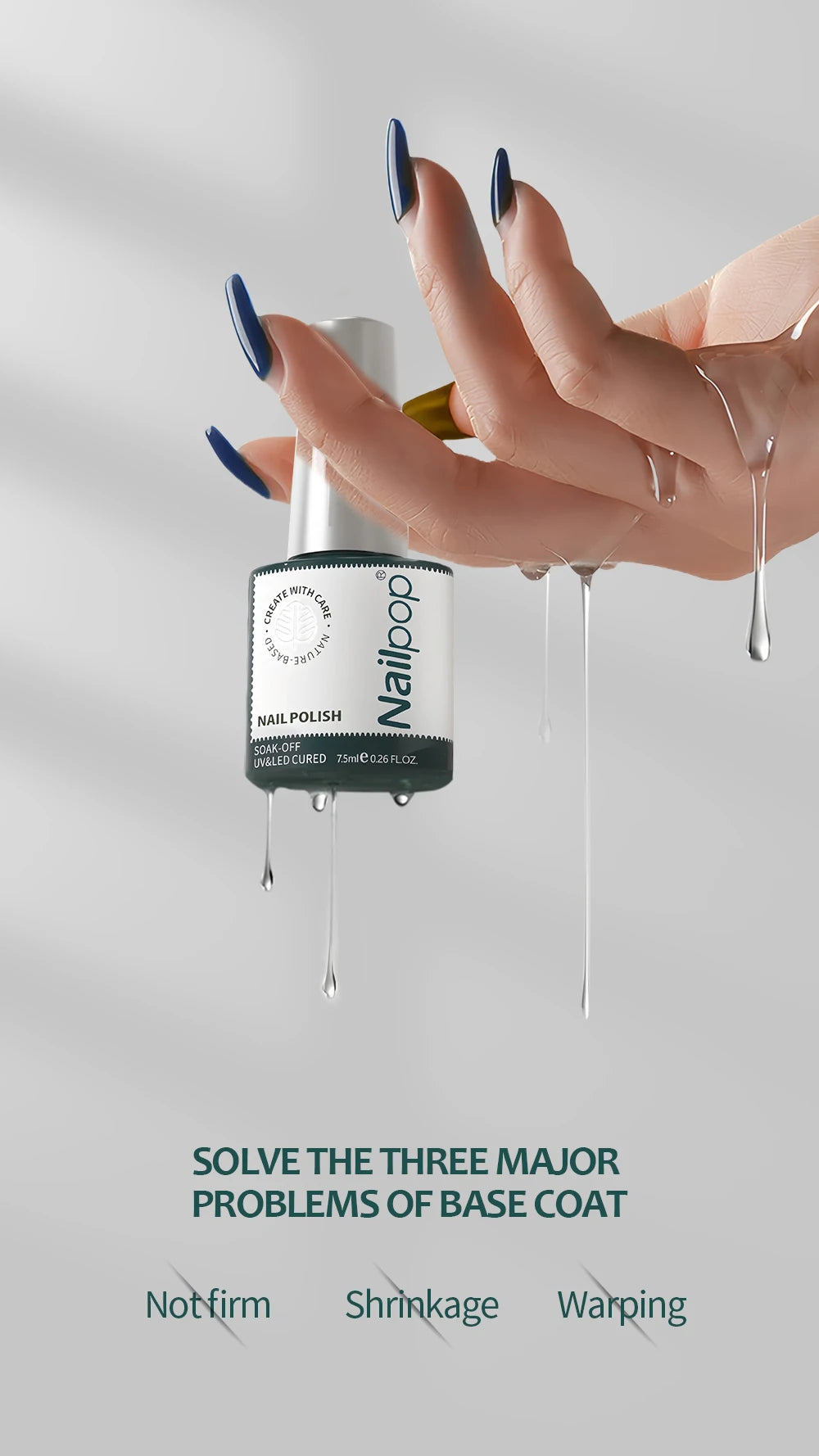 Hand holding a bottle of nail polish with text on a gray background