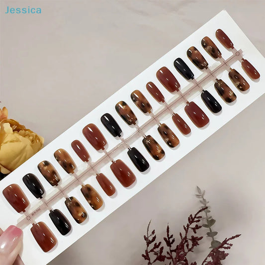 Set of brown and black nail samples on a display card with 'Jessica' branding.