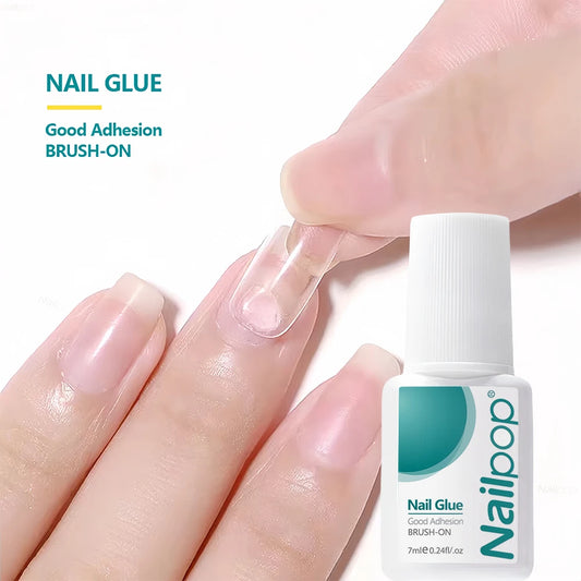 Nail Glue being applied to a finger with a bottle of Nailloop nail glue in the foreground.