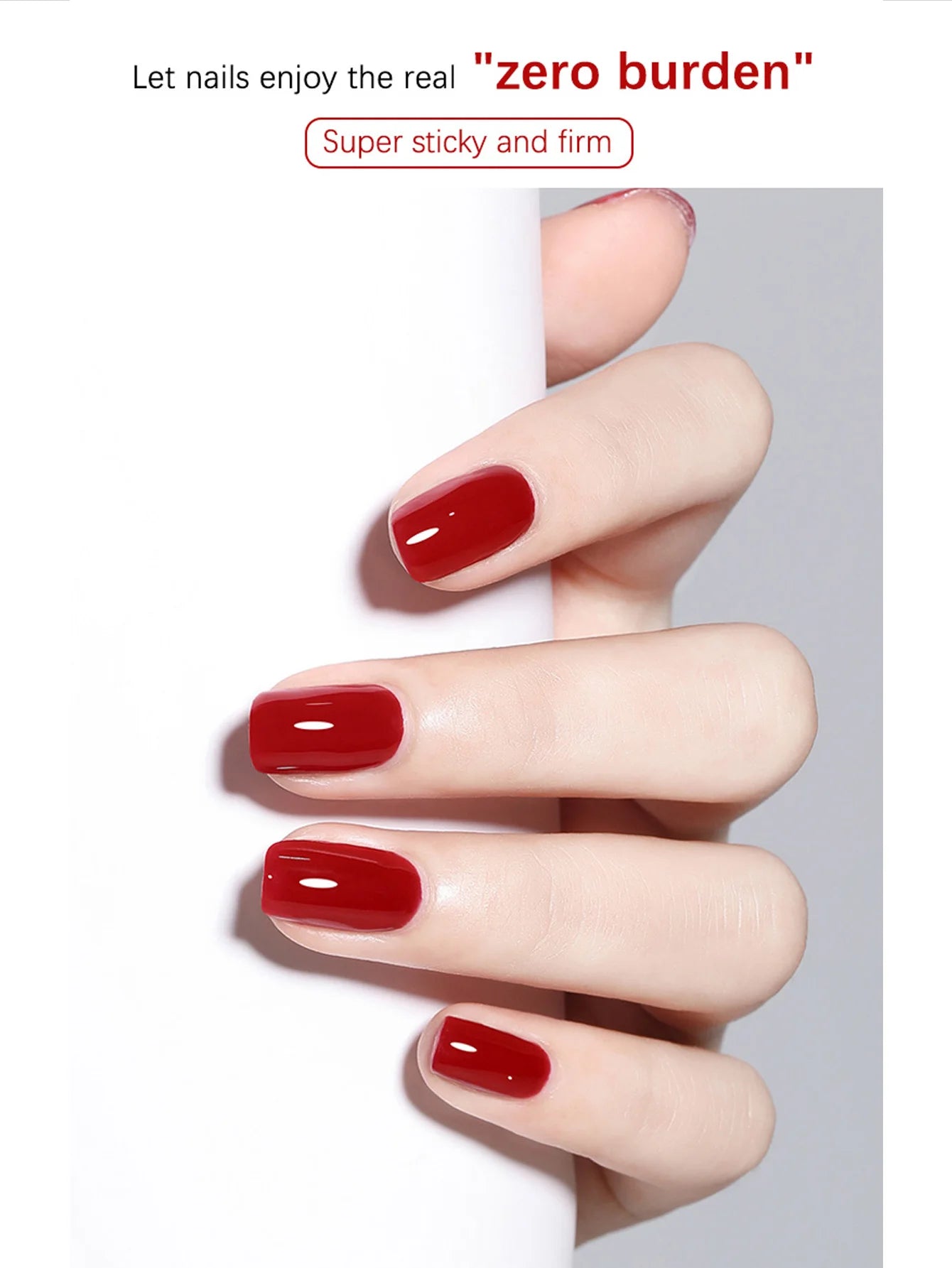 Hand with red nail polish on a white background, promoting 'zero burden' nail product.