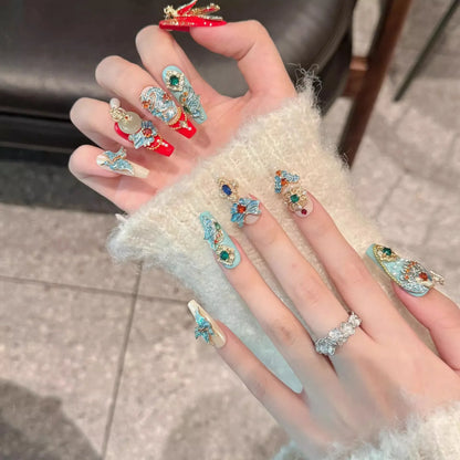 Hand wearing multiple decorative rings with gemstones on a neutral background
