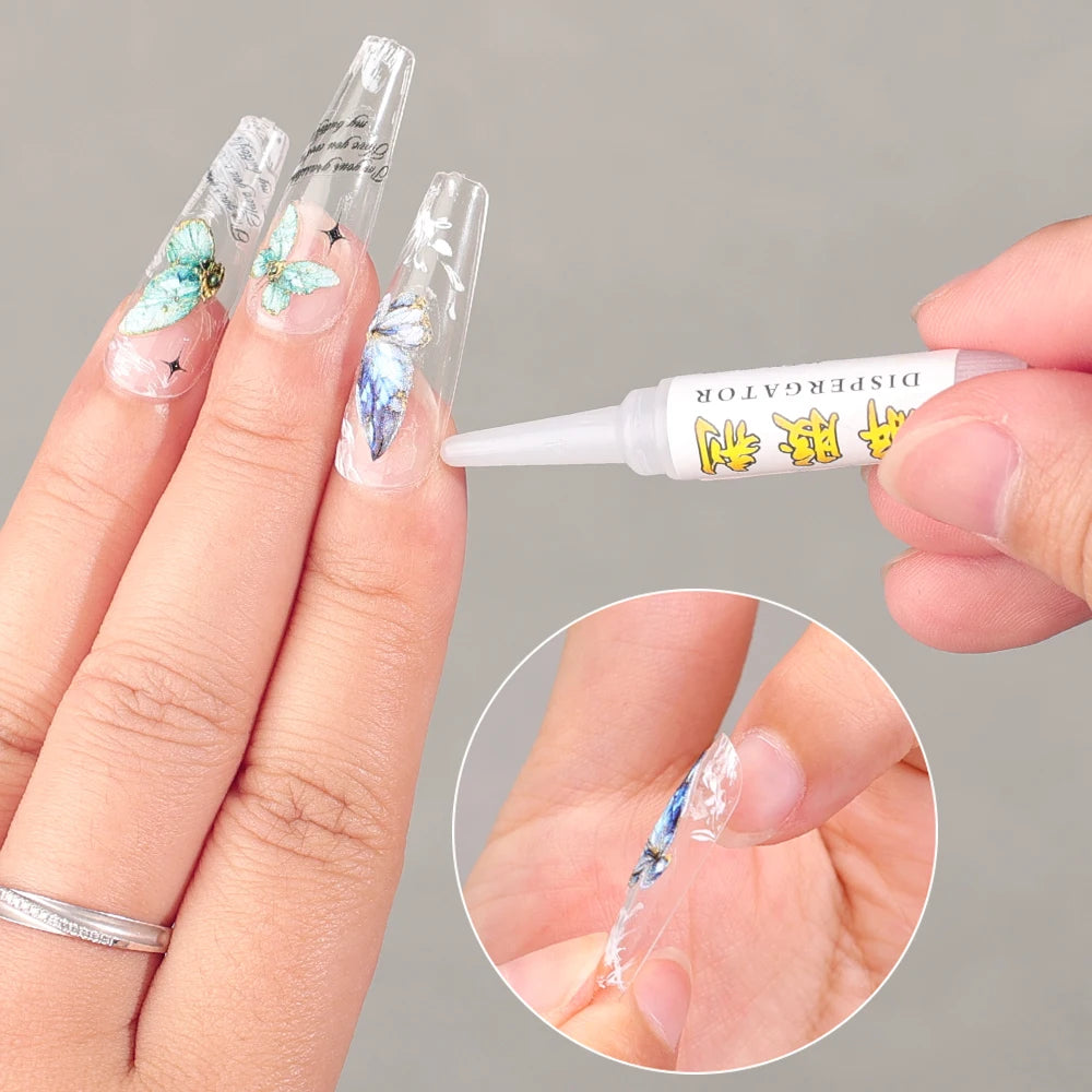 Nail art application with a tube of glue and floral nail designs.