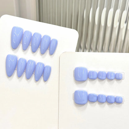 Set of light blue false teeth on a white background