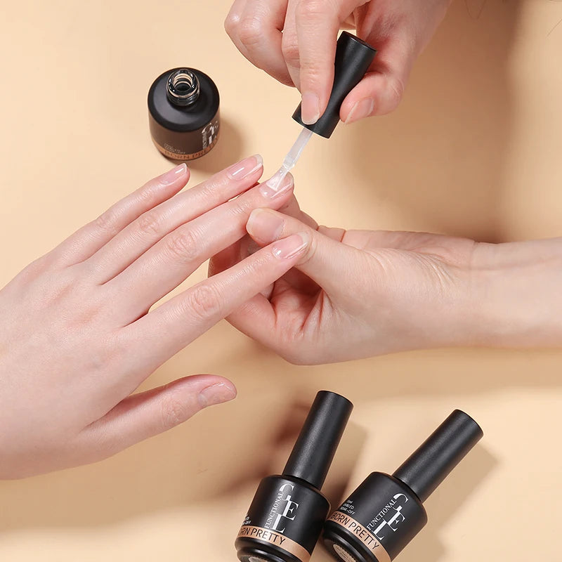 Person applying nail polish to another person's nails with a beige background