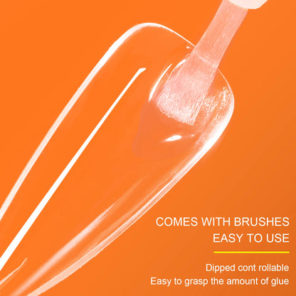 Nail polish brush with a clear liquid on an orange background