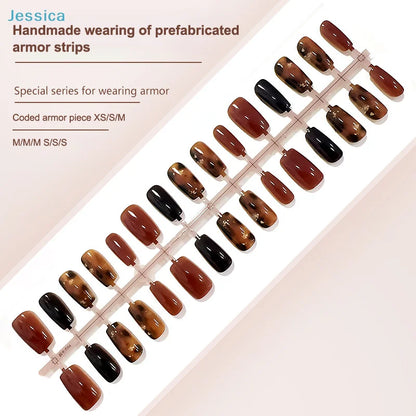Set of brown and black nail armor strips on a display board with product details.