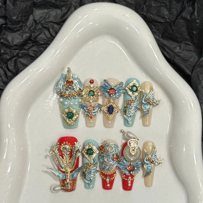 Decorative nail art designs on a white dish with a black textured background