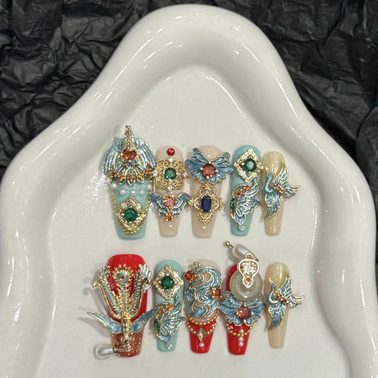 Decorative nail art designs on a white dish with a black textured background