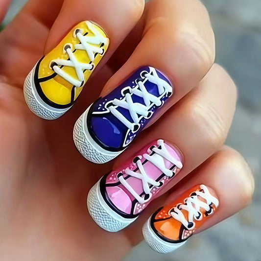 Nail art design resembling sneakers with colorful soles on a hand.