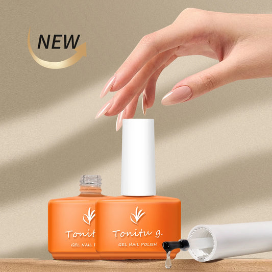 Orange nail polish bottle with white cap and 'Tonitu g.' branding, hand with painted nails in the background.