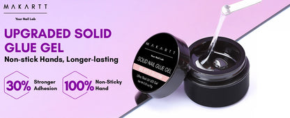 Makartti solid nail glue gel with open jar and applicator on a purple background