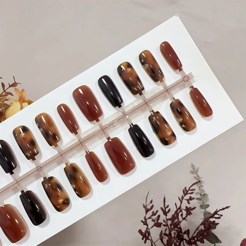 Set of brown and black nail polish samples on a white tray with 'Jessica' branding.