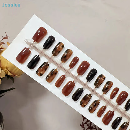 Set of brown and black nail samples on a display board with 'Jessica' branding.