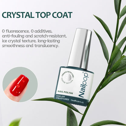 Nail polish bottle with red nail color and plant leaves in the background