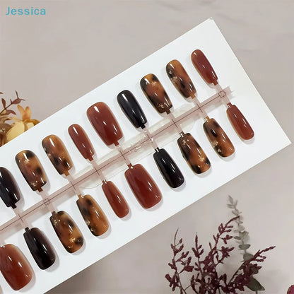 Set of brown and black nail polish samples on a white tray with 'Jessica' branding.