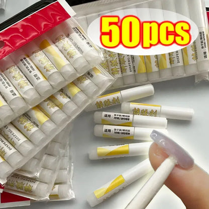 Packaging of 50 dental dams with a close-up of one being held.