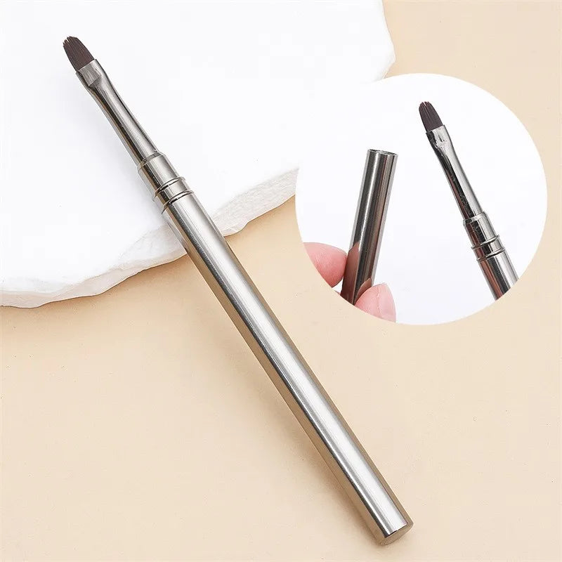 Makeup pen with brush tip on a beige background